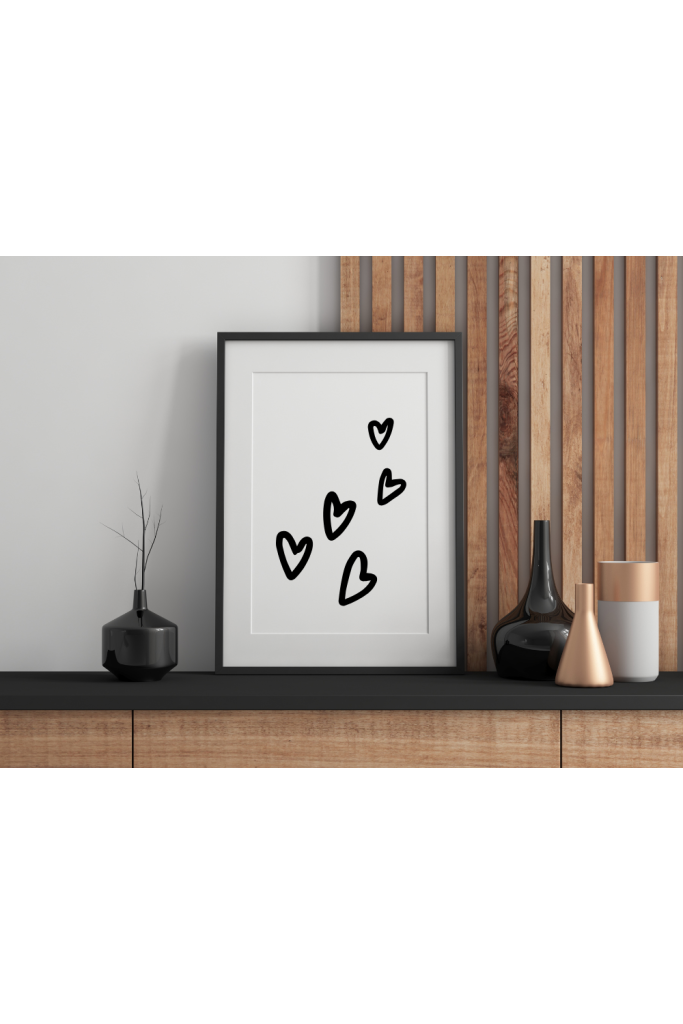 A digitally printed poster in a frame, sitting on a table.