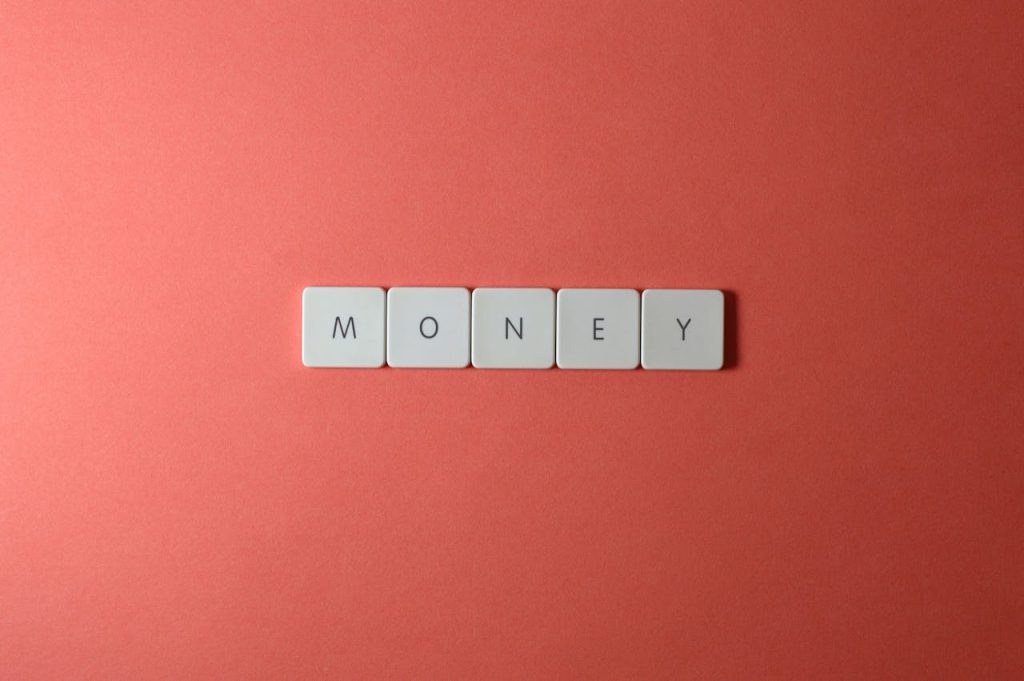 Image of the word 'Money' introducing an article that defines 40 key financial terms for building financial literacy.
