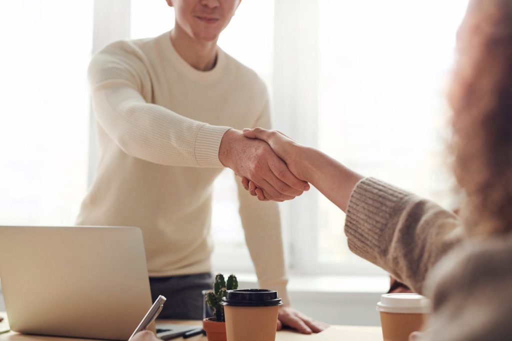 Collaborating with Other Etsy Sellers An image of a handshake between two people agreeing to collaborate and work together.
