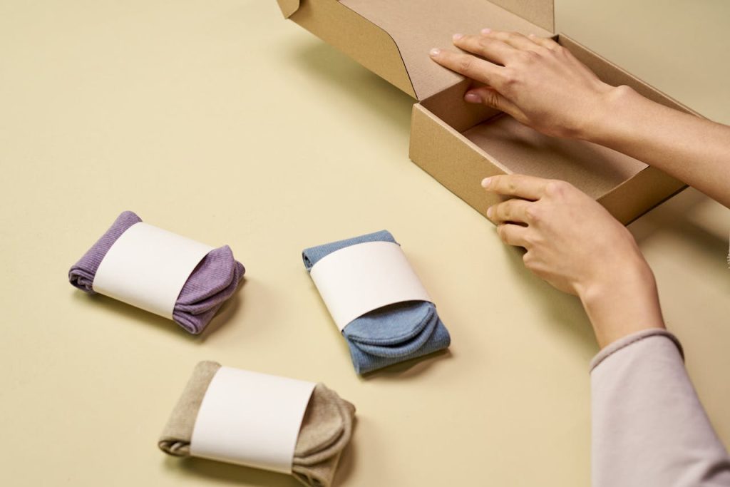 Efficient Inventory Management for Seamless Order Fulfillment A woman fulfilling an Etsy order by packing a product for shipment.