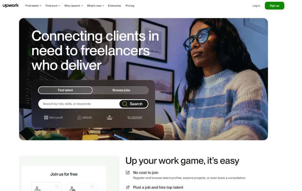 Upwork homepage with a woman working at a computer, promoting freelancer services for top companies like Microsoft and Airbnb.